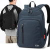 A navy blue fashion commuter daypack being worn by a person.