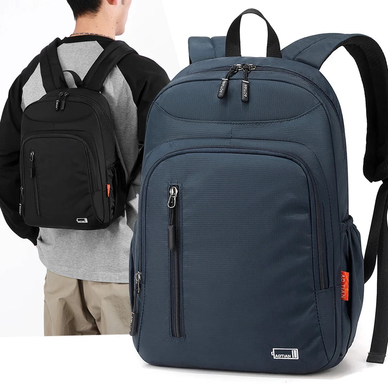 A navy blue fashion commuter daypack being worn by a person.