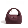 A deep burgundy nylon dumpling crossbody shoulder bag with a brown leather strap and flap.
