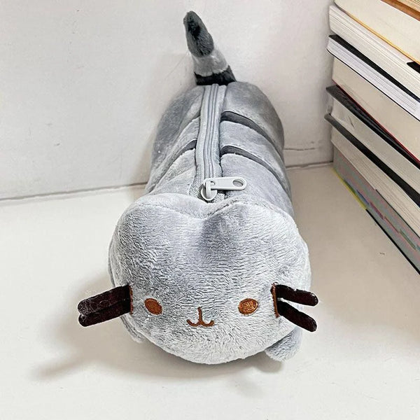 A soft gray anime cat plush toy with a storage pouch on its back