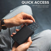 A hand holds a black slim aluminum pop-up card holder with a patterned sleeve, demonstrating quick access.