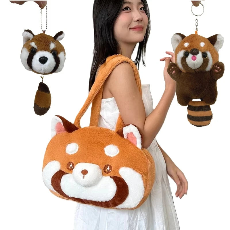 A woman is holding an orange red panda plush backpack and a hanging red panda charm.