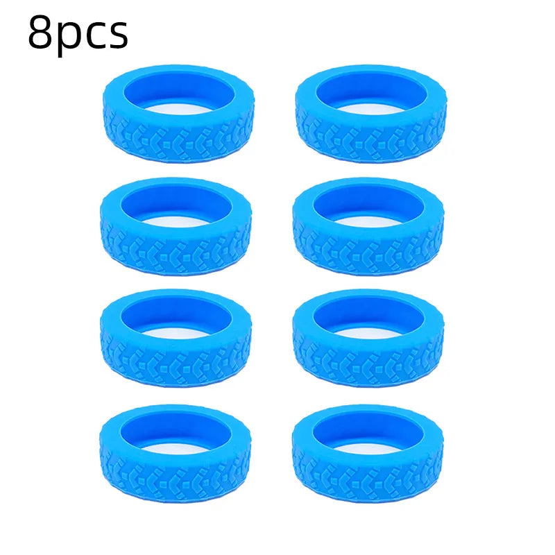 A set of eight bright blue silicone luggage wheel protection rings.