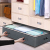 A storage organizer with a mattress top is being placed into a wooden bed frame with drawers and hanging space.