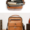 A brown vintage PU leather crossbody messenger bag with a flap and internal organization for pens and small items.
