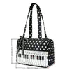 Black tote bag with white polka dots featuring a piano lace trim and bow detail.