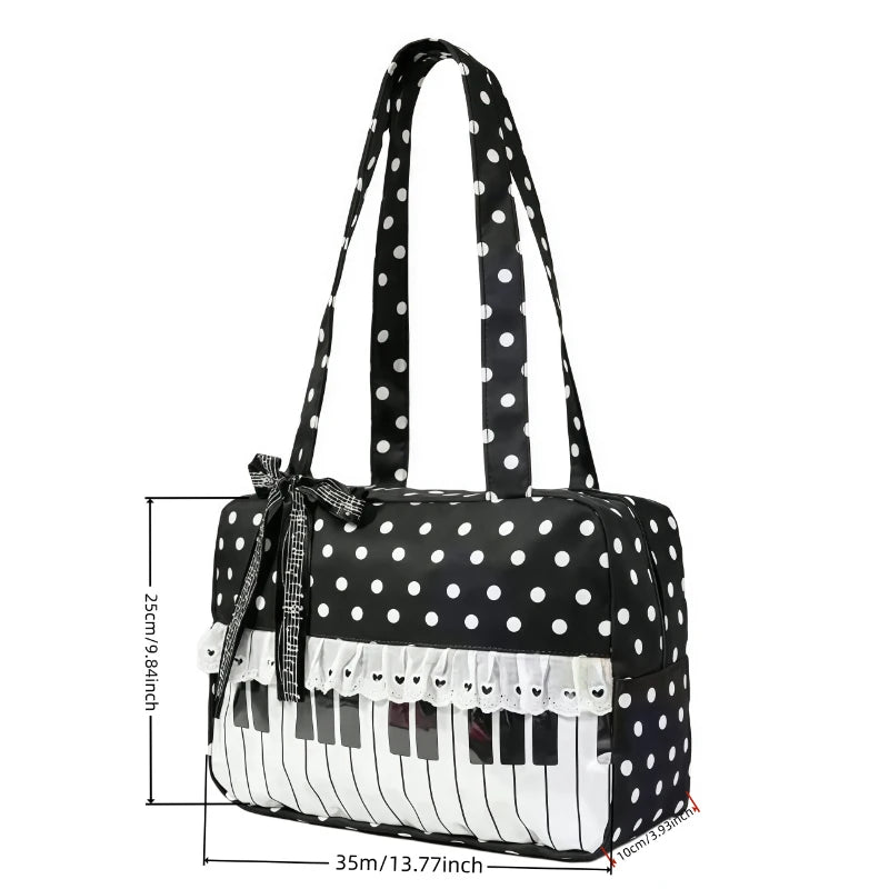 Black tote bag with white polka dots featuring a piano lace trim and bow detail.
