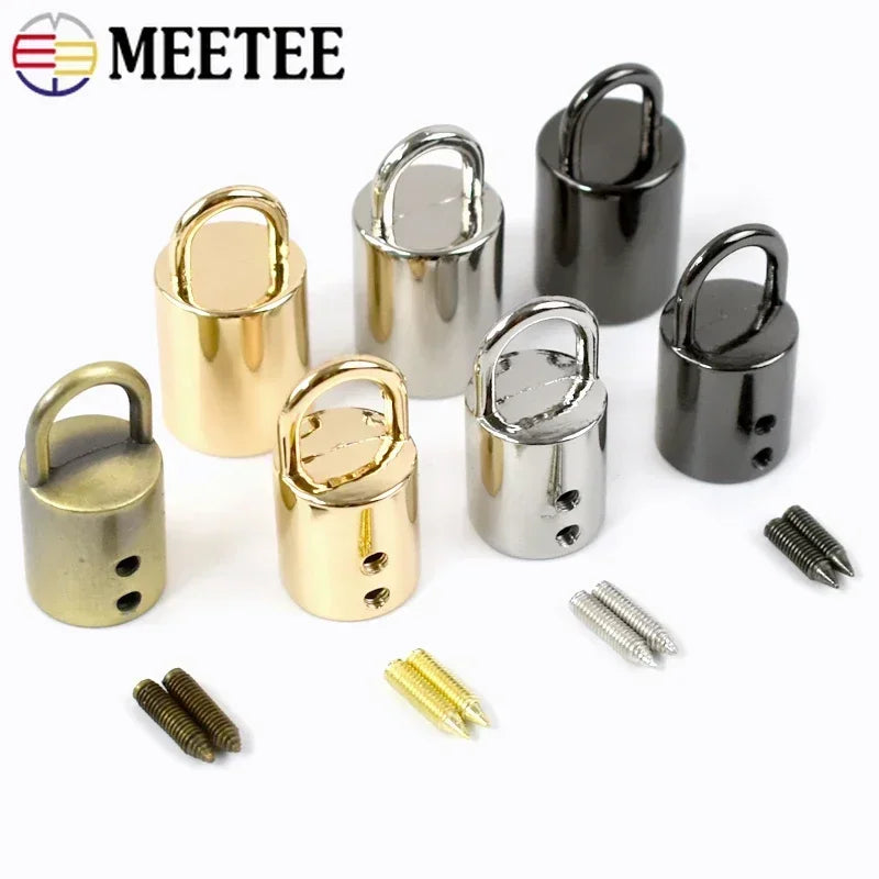 A collection of metal cord lock buckles in gold and black finishes for bags, straps, and crafts.