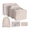 A set of beige fabric storage organizers and pouches for organizing various items.