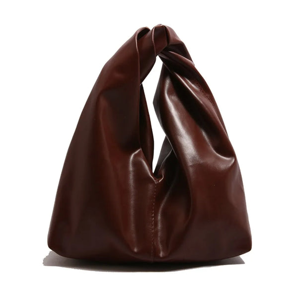 A dark brown leather minimalist crossbody tote bag folded and displayed on a white background.