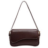 Bolso cruz de cuero marrón oscuro estilo vintage con correa delgada.