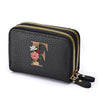 Black faux leather mini wallet with a gold zipper and a floral letter print
