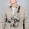 A young man wearing a beige shirt holds a personalized printed crossbody sling bag with leather straps.