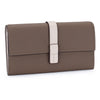 A brown genuine cow leather bifold wallet with a light beige strap shown from the side.