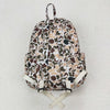A toddler camouflage backpack featuring animal prints in brown, beige, and olive tones.