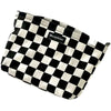 A black and white checkered cosmetic storage bag with Moonshine branding.