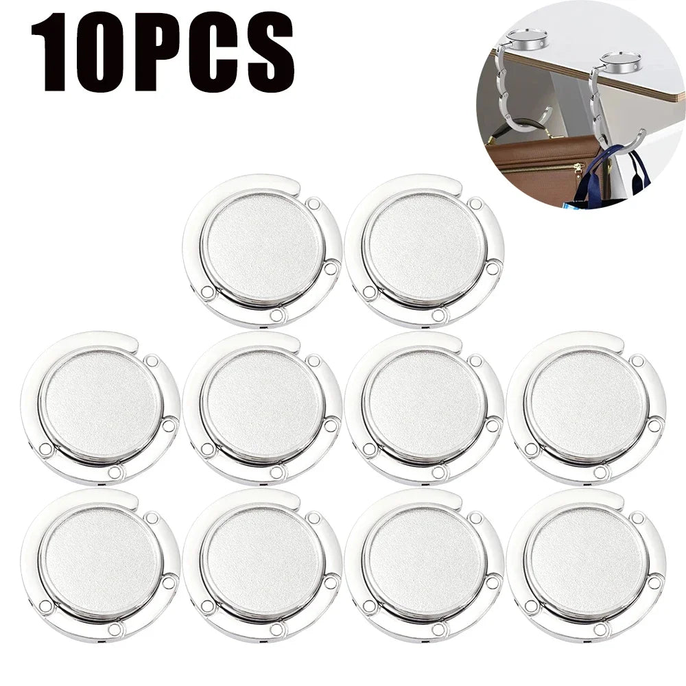 Ganchos plegables plateados para mesa y organización de bolsos