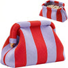A red and purple striped knit clutch bag with a matching pouch is shown.