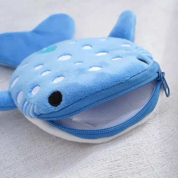 A light blue shark mini plush coin purse wallet with black and white polka dots.