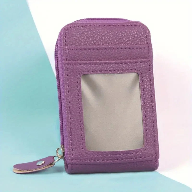 A purple multi-slot card holder wallet with a clear window is shown against a light blue background.