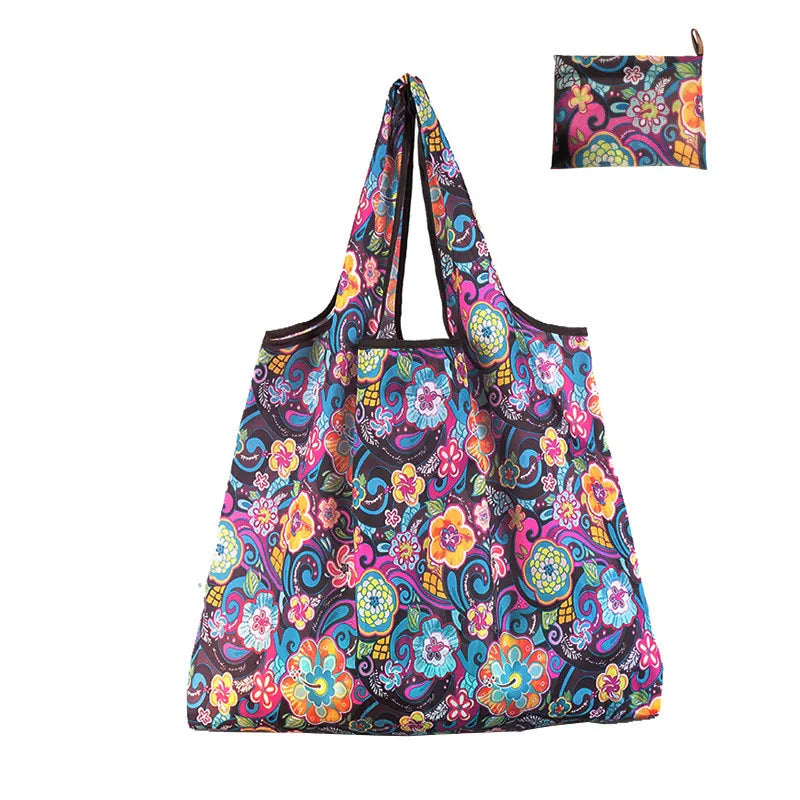 A colorful, floral patterned nylon reusable tote bag displayed against a white background.