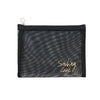A black mesh travel cosmetic storage pouch with a gold star charm attached.