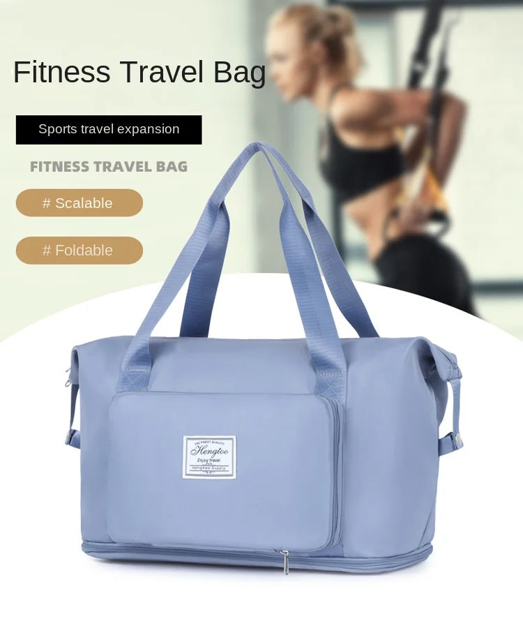 A light blue fitness travel bag with shoulder straps is shown on a white surface.