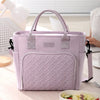 A light purple durable insulated lunch bag with a handle and zipper is shown on a table.