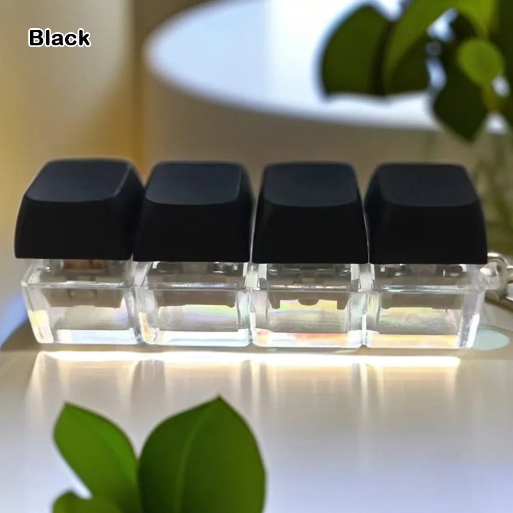 A row of black tactile stress relief keyboard fidget toys illuminated on a surface.