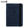 A dark blue leather passport holder with a black zipper and a silver airplane emblem.