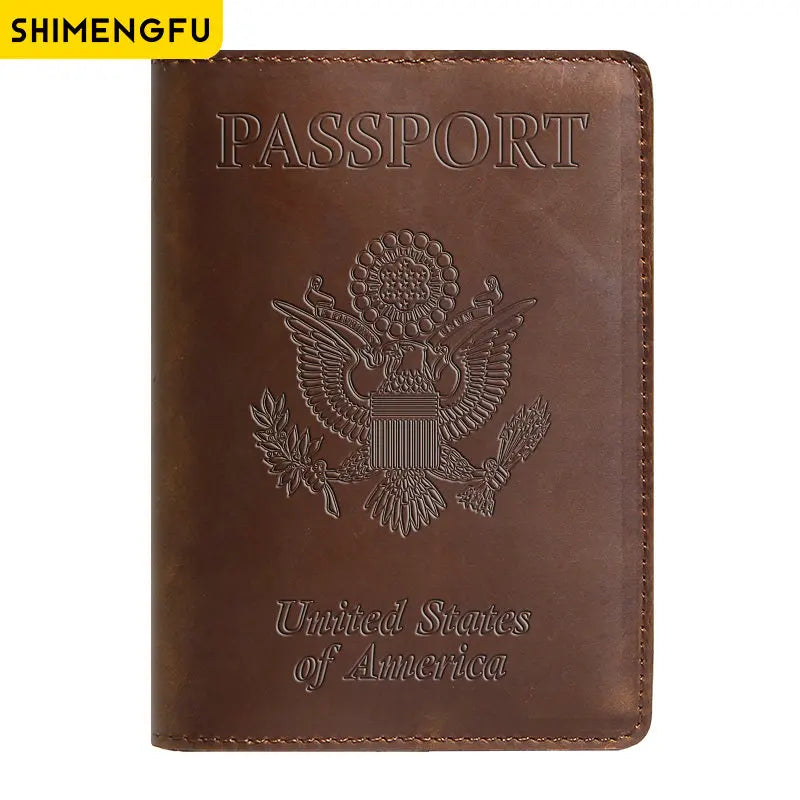 A brown genuine leather passport holder featuring the United States of America eagle emblem embossed on the cover.