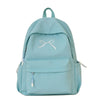 A light blue embroidered nylon backpack with a drawstring closure and multiple pockets.