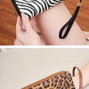 A tri-fold leopard print RFID-blocking wallet with a wrist strap shown in various angles.