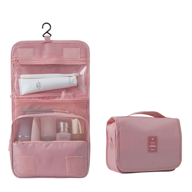 Pinkes tragbares Reise-Toilettenorganizer-Bag mit Aufhängeverschluss, zeigt Innenteile und Außentasche.