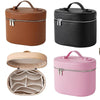 A set of three travel makeup organizers in brown, black, and pink leather-like material with zipper closures.