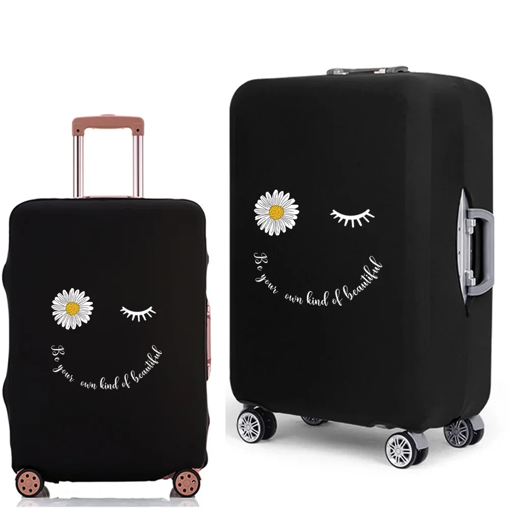 Black rolling suitcase with a face design featuring daisies and eyelashes.
