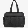 A black large capacity women's travel duffle bag with a padded design.