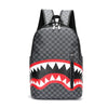 A black plaid laptop backpack featuring a red and white tooth pattern design.