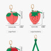 A collection of colorful fruit-themed coin purse keychains featuring various fruits like peach, strawberry, and cherry.