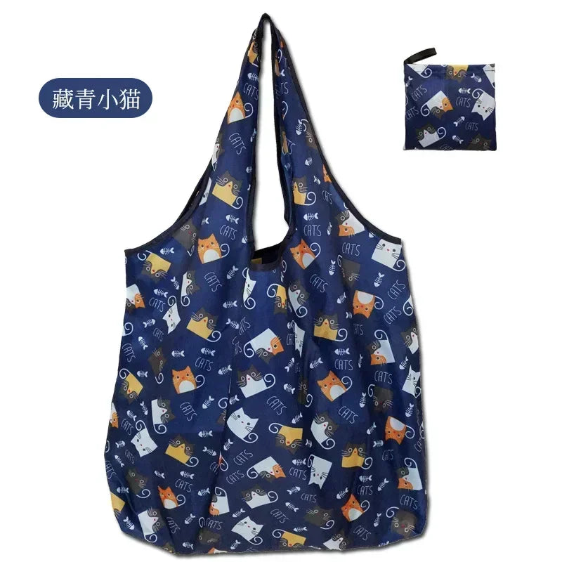 A dark blue tote bag featuring a fold-over flower print design.