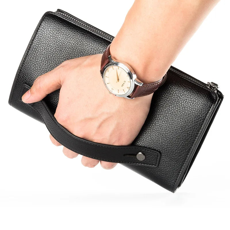 A hand holding a black leather business handbag clip wallet with a watch.