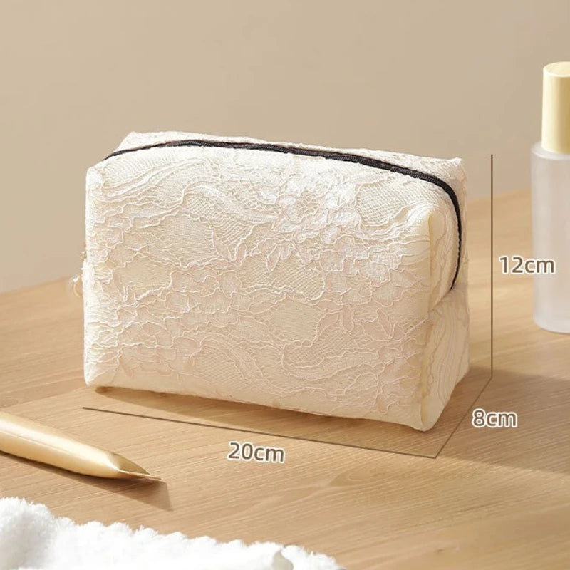 A rectangular white lace mesh organizer bag is shown on a wooden surface with measurement lines.