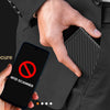 A hand holds a smartphone displaying an RFID scanner icon near a black magnetic card holder wallet.