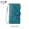 A teal leather trifold clutch wallet with a gold-toned clasp and a thin strap.