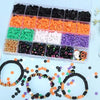 A plastic tray holds various colored polymer clay beads and a set of bracelets for making Halloween themed jewelry