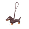 A brown leather dachshund charm with a loop for a keychain.