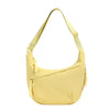 A light yellow canvas crossbody bag with a thin strap shown from the front.