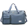 A light blue travel duffle bag with padded compartments and shoulder straps.