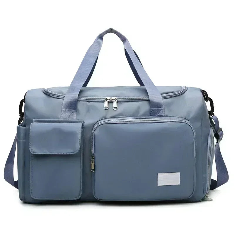 A light blue travel duffle bag with padded compartments and shoulder straps.