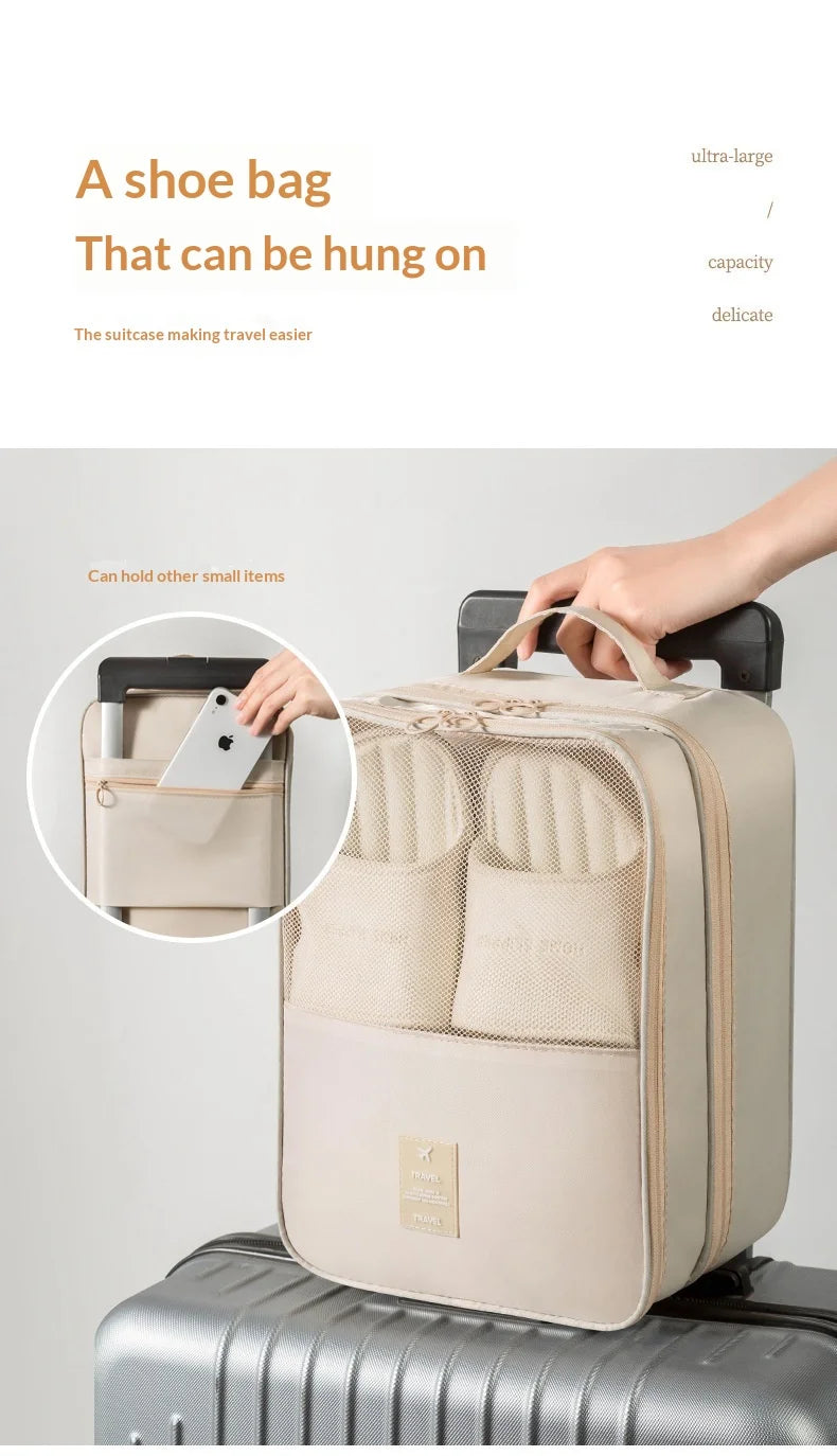 A beige portable luggage shoe organizer bag with multiple compartments is shown resting on a silver suitcase.